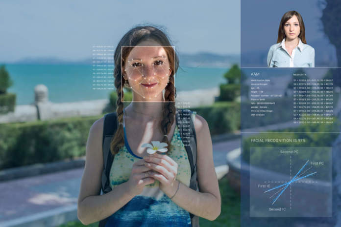Recognition of a female face by layering a mesh and the calculation of the personal data by the software. Biometric verification and identification - ph credits: AdobeStock