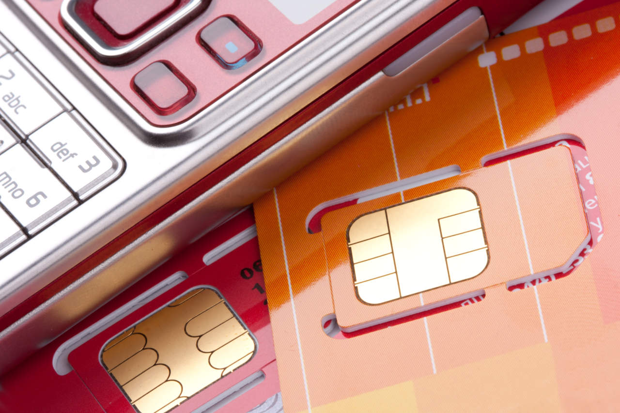 Close-up of mobile phone with sim cards - ph credits: AdobeStock